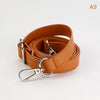 A brown PU leather strap for a crossbody bag, showing the buckle and leather texture.