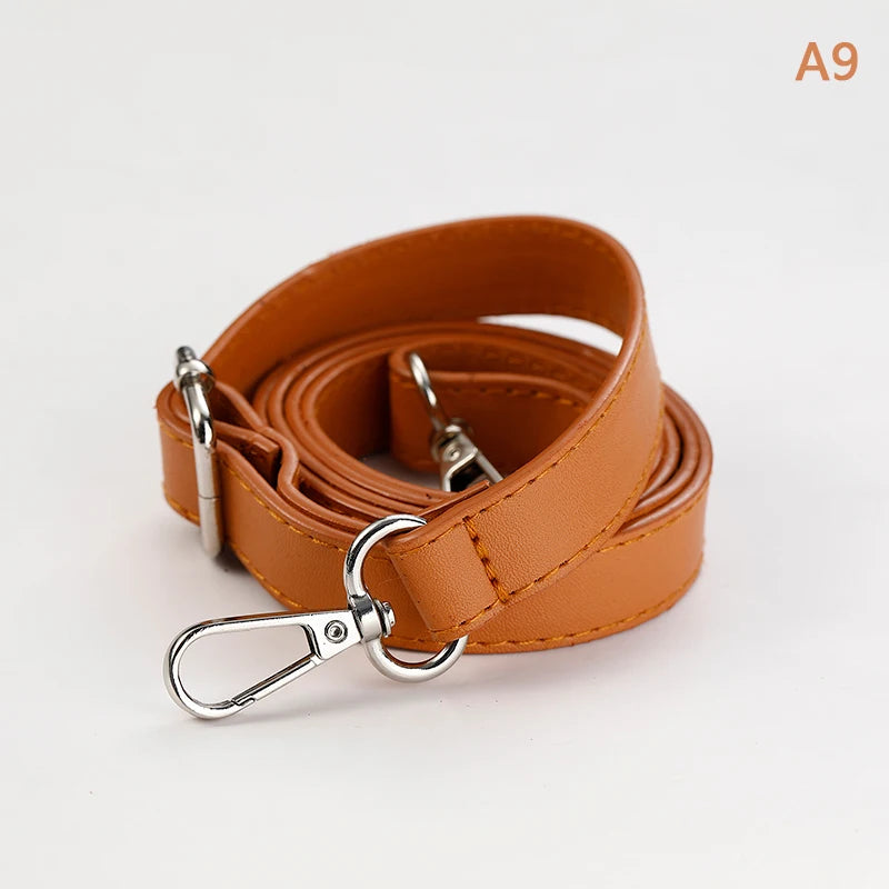 A brown PU leather strap for a crossbody bag, showing the buckle and leather texture.