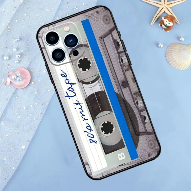 A phone case featuring a vintage cassette tape design with a blue stripe and a gold starfish decoration.