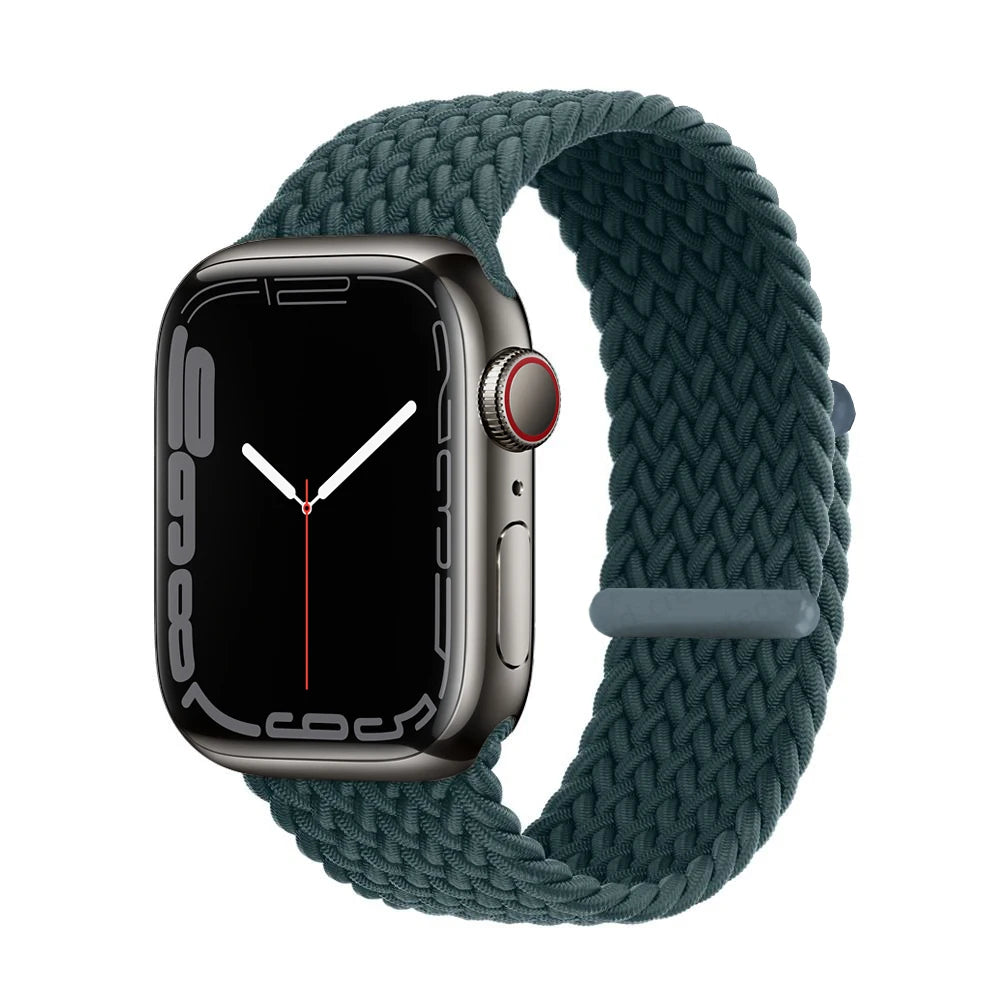 A dark green braided stretch band worn around an Apple Watch.