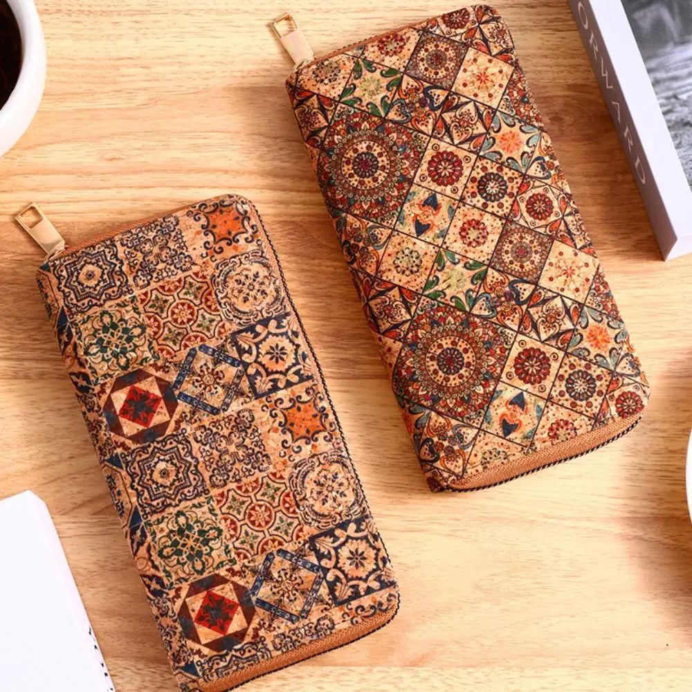 A patterned bohemian wood-grain leather wallet with multiple card slots resting on a light wooden surface.