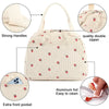 A cream-colored corduroy lunch bag with a textured pattern, featuring strong handles, a double zipper, and an extra front poc