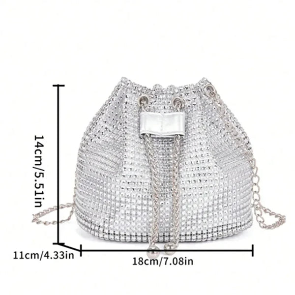 Silver rhinestone drawstring crossbody bag with a rectangular white strap and gold chain details