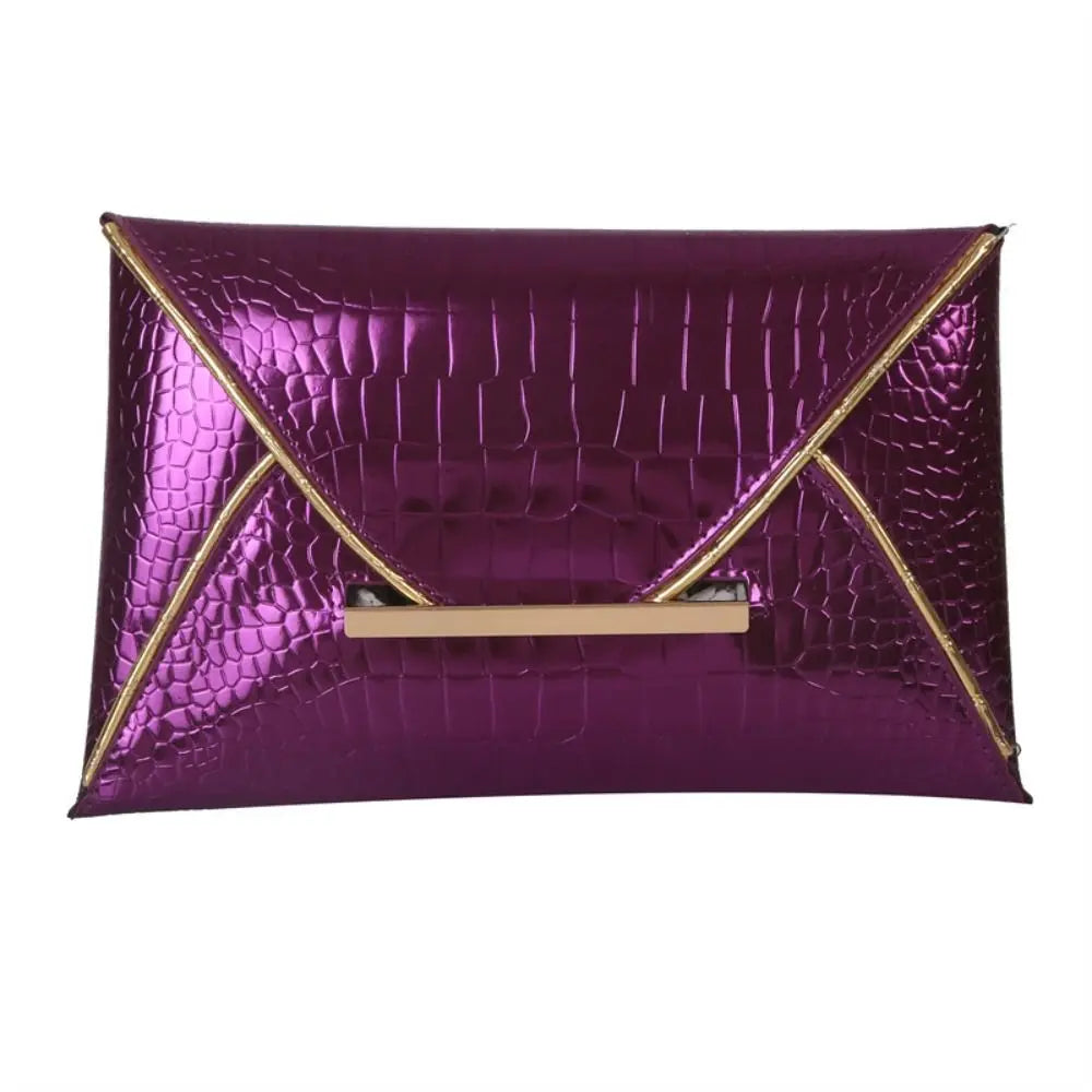 A vibrant purple crocodile pattern coin purse clutch with a gold accent.