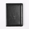 Black RFID blocking PU leather passport holder with an embossed eagle design.