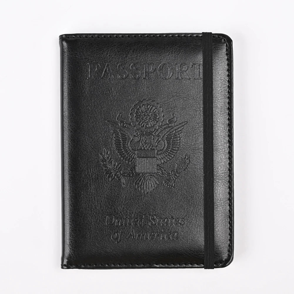 Black RFID blocking PU leather passport holder with an embossed eagle design.