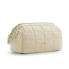 A beige padded makeup bag with a quilted texture and gold zipper.