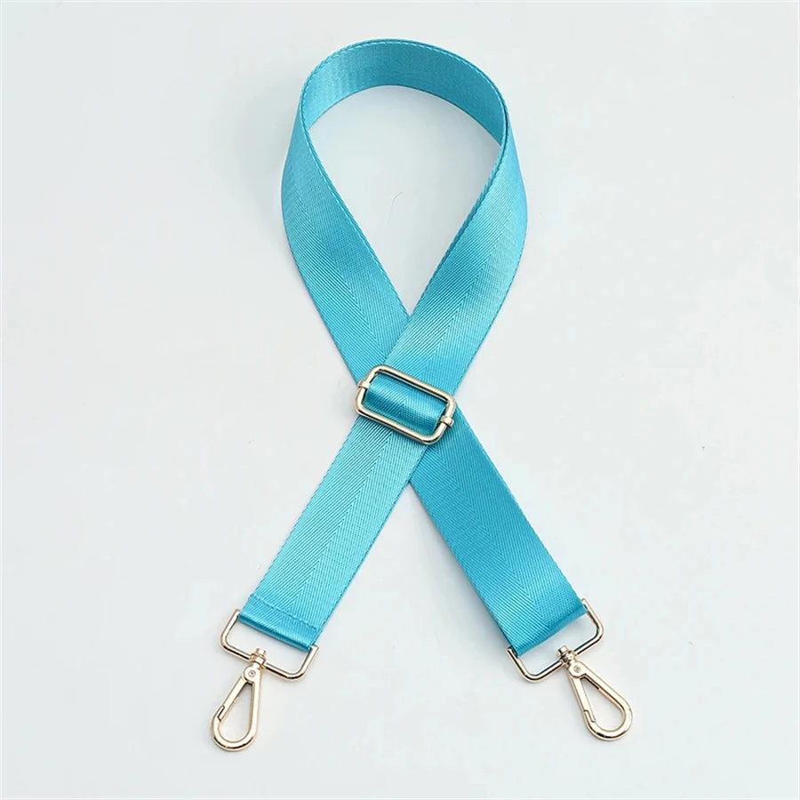 A turquoise nylon shoulder strap with a buckle is shown against a white background.