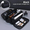 Black PU leather travel toiletry bag with organizer pockets shown in a top-down view.