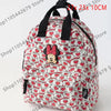 Mochila de peluche de ratón pato con estampado rojo y blanco.