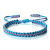 Handmade braided rope bracelet featuring purple and blue threads.