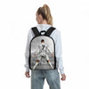 A white long-sleeve shirt with a black backpack featuring a cartoon image of a football player in a Juventus kit.
