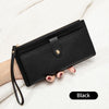 A black elegant PU leather coin purse and card holder is shown being held against a white blanket.