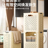 A large, light beige foldable laundry basket with perforated sides and handles is shown in a modern interior setting.