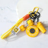 Yellow and orange detachable dumbbell keychain charm with black chain.