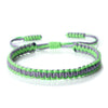 Handmade braided rope bracelet with green and purple threads, adjustable friendship gift.