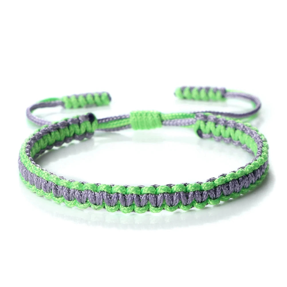 Handmade braided rope bracelet with green and purple threads, adjustable friendship gift.