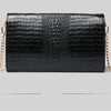 Black alligator pattern leather clutch bag with gold chain strap