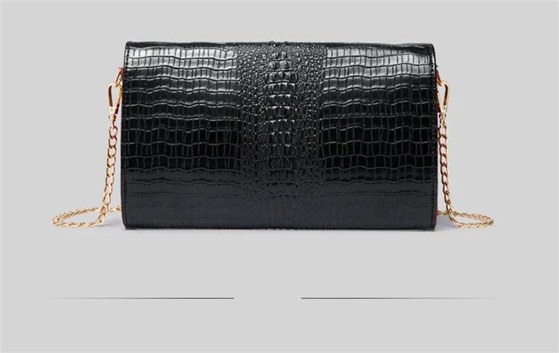 Black alligator pattern leather clutch bag with gold chain strap