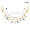 Accesorio de cadena de oro con charmes de corazón de esmalte y estrella azul con detalles de perla