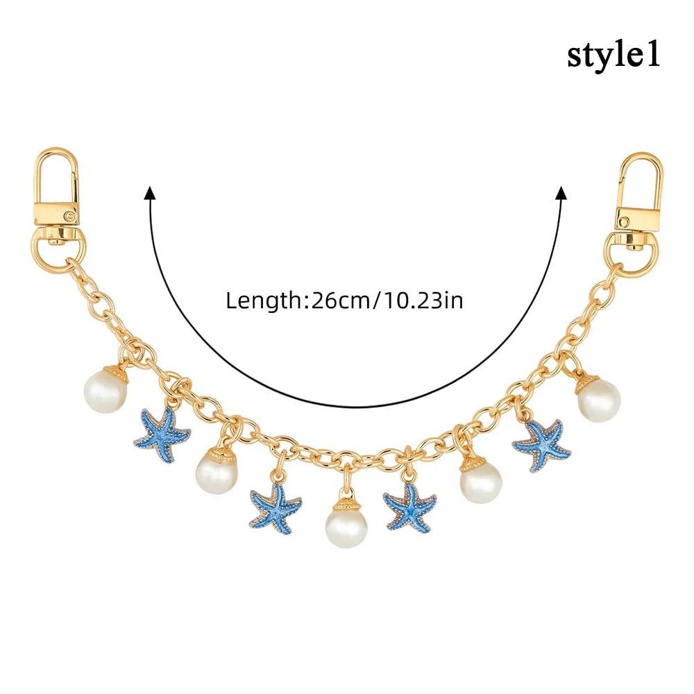 Accesorio de cadena de oro con charmes de corazón de esmalte y estrella azul con detalles de perla