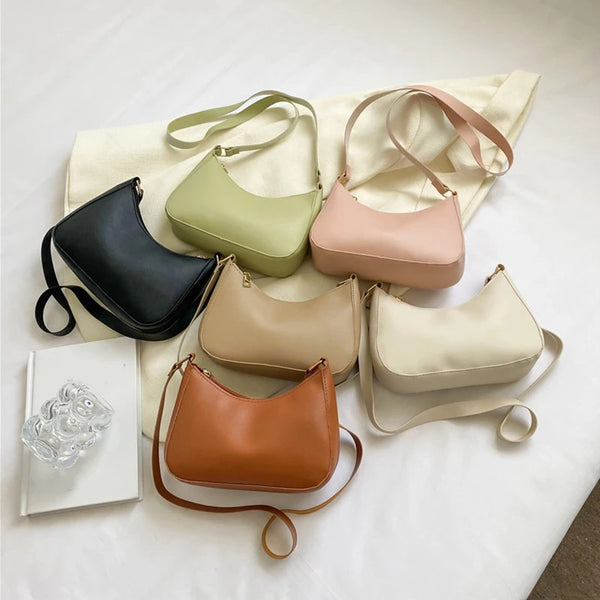 A collection of five retro solid color PU leather shoulder bags in shades of black, olive green, beige, pink, and tan, displa