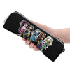 A hand holds a black elegant leather pencil case featuring illustrations of magical girls.