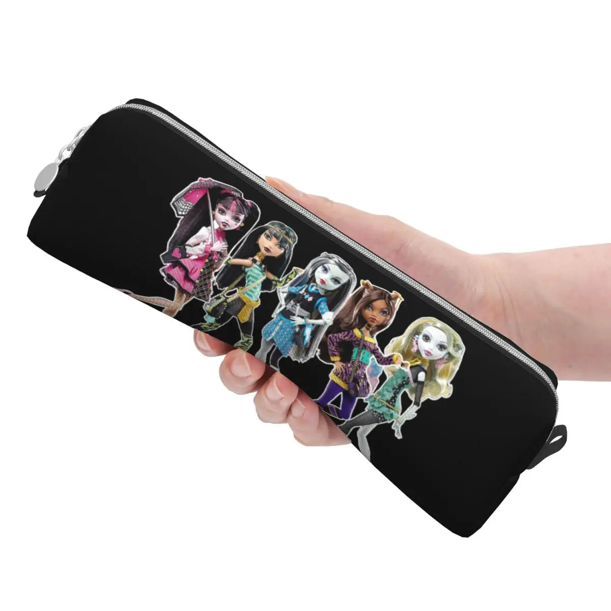 A hand holds a black elegant leather pencil case featuring illustrations of magical girls.