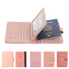 A pink leather passport organizer featuring multiple card slots and a dark blue passport.