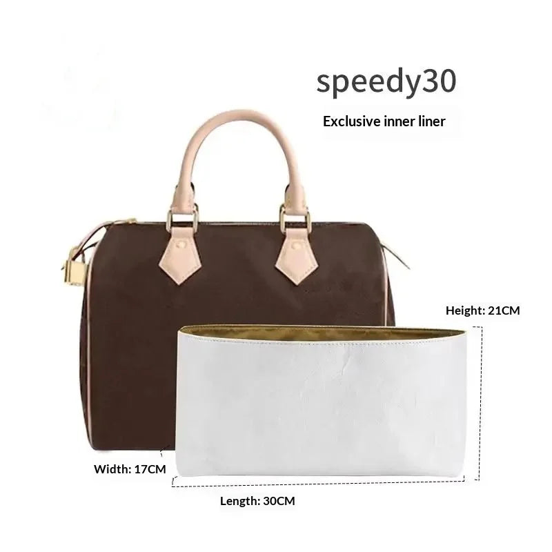 A brown leather tote bag with a beige shoulder strap and a white interior lining.