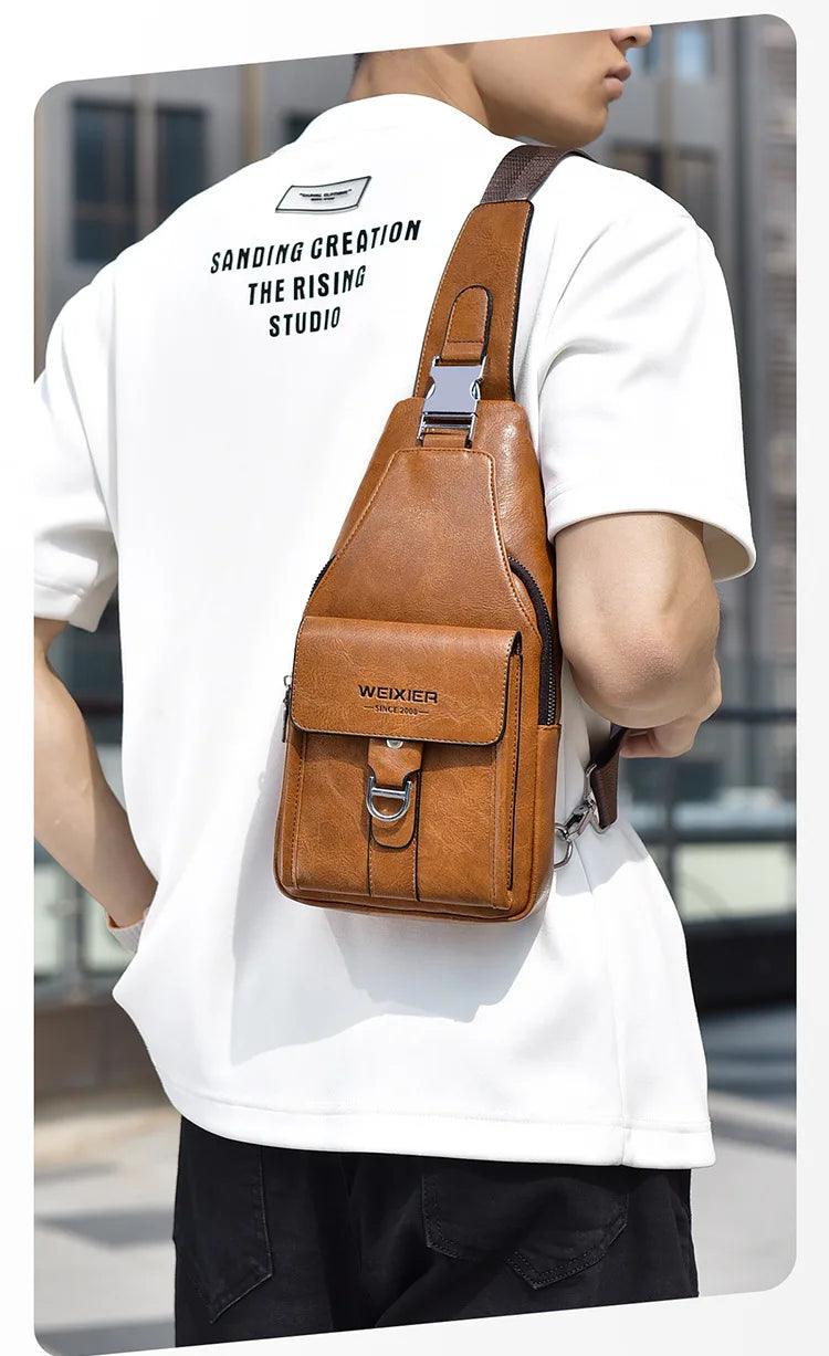 A man wearing a white t-shirt displays a brown PU leather belt sling chest bag on his torso.