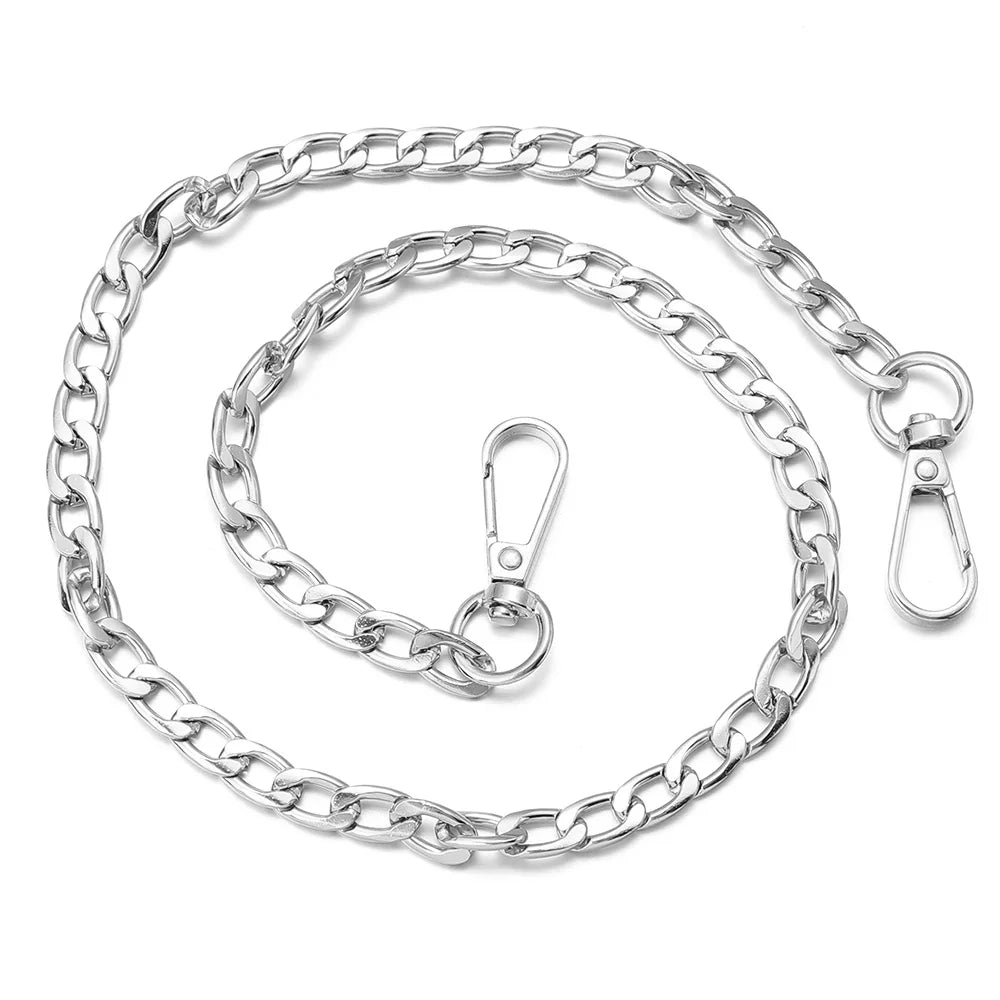 Silver adjustable metal bag strap chains laid out in a circular pattern.