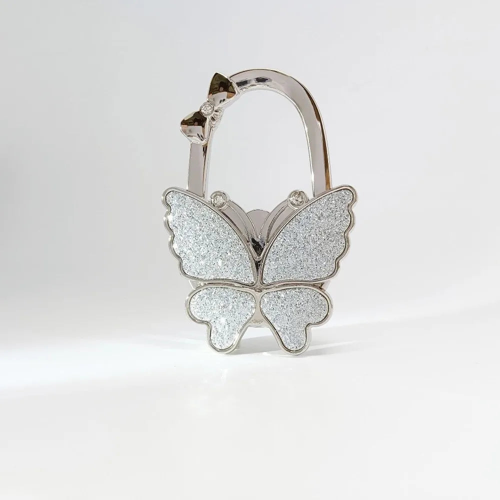Silver foldable butterfly shaped handbag hook with glitter texture