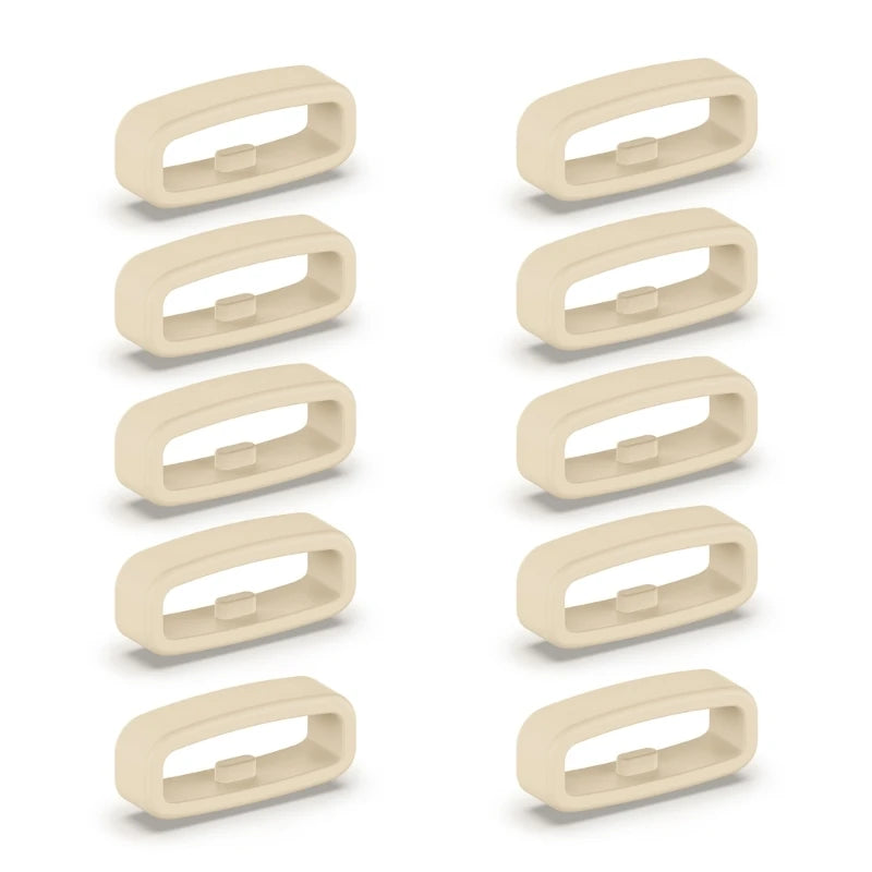 A set of five beige silicone watch strap retainer rings shown individually.