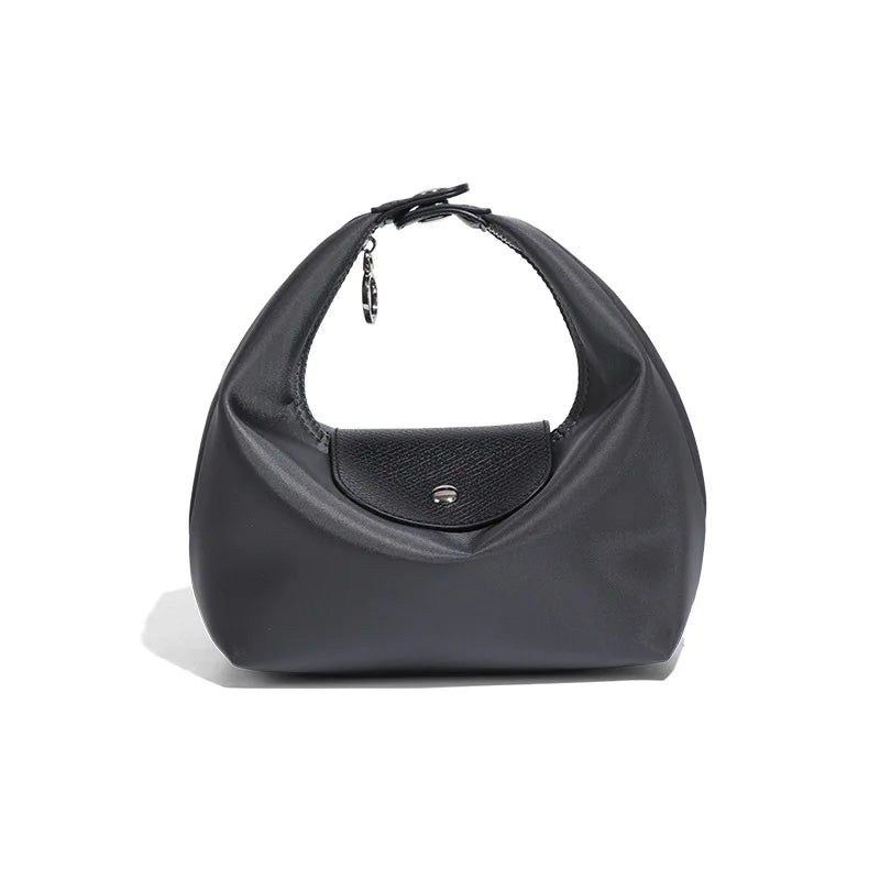 A black waterproof nylon crossbody bag with dual straps shown from the front.
