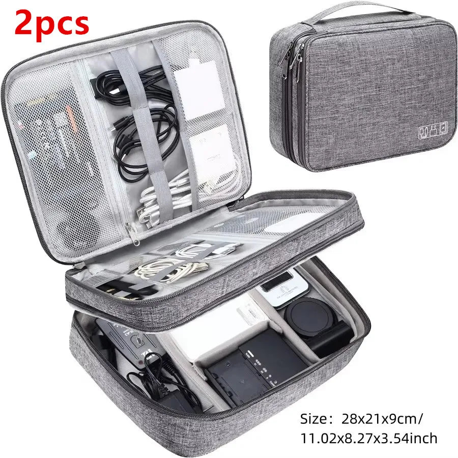 A gray portable digital organizer storage pouch with a zippered compartment and an open section displaying various electronic
