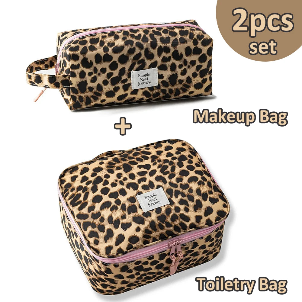 A set of two leopard print makeup bags, including a makeup bag and a toiletry bag.