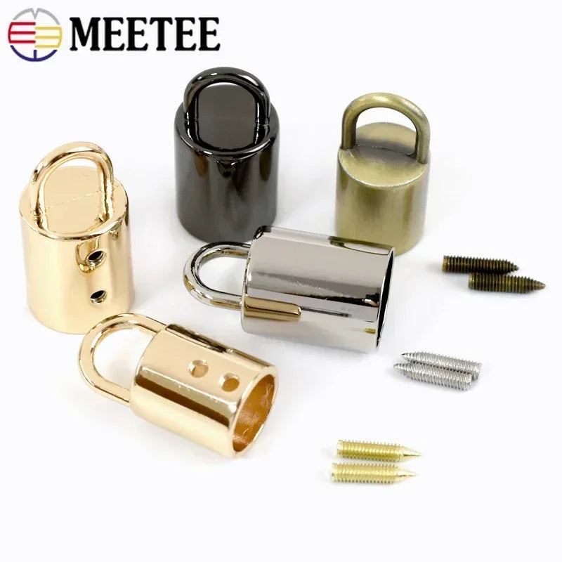 A collection of metal cord lock buckles in gold and silver finishes for bags, straps, and crafts.
