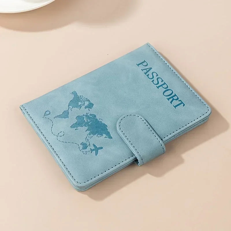 A light blue passport wallet with a map design and the word PASSPORT printed on it.