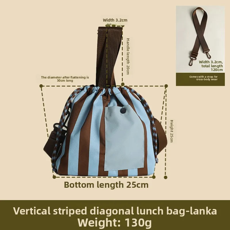 Vertical striped diagonal lunch bag-lanka with a brown strap and light blue fabric.