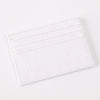 A white slim PU leather card holder wallet with a textured crocodile pattern.
