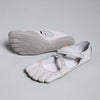 A pair of light gray women's barefoot five-toe shoes with an adjustable strap shown from the top and side.
