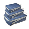 A set of blue and gray reusable compression packing cubes stacked on a white background.