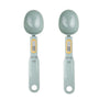 A pair of light gray precision digital kitchen scales with oval weighing bowls and measuring displays.