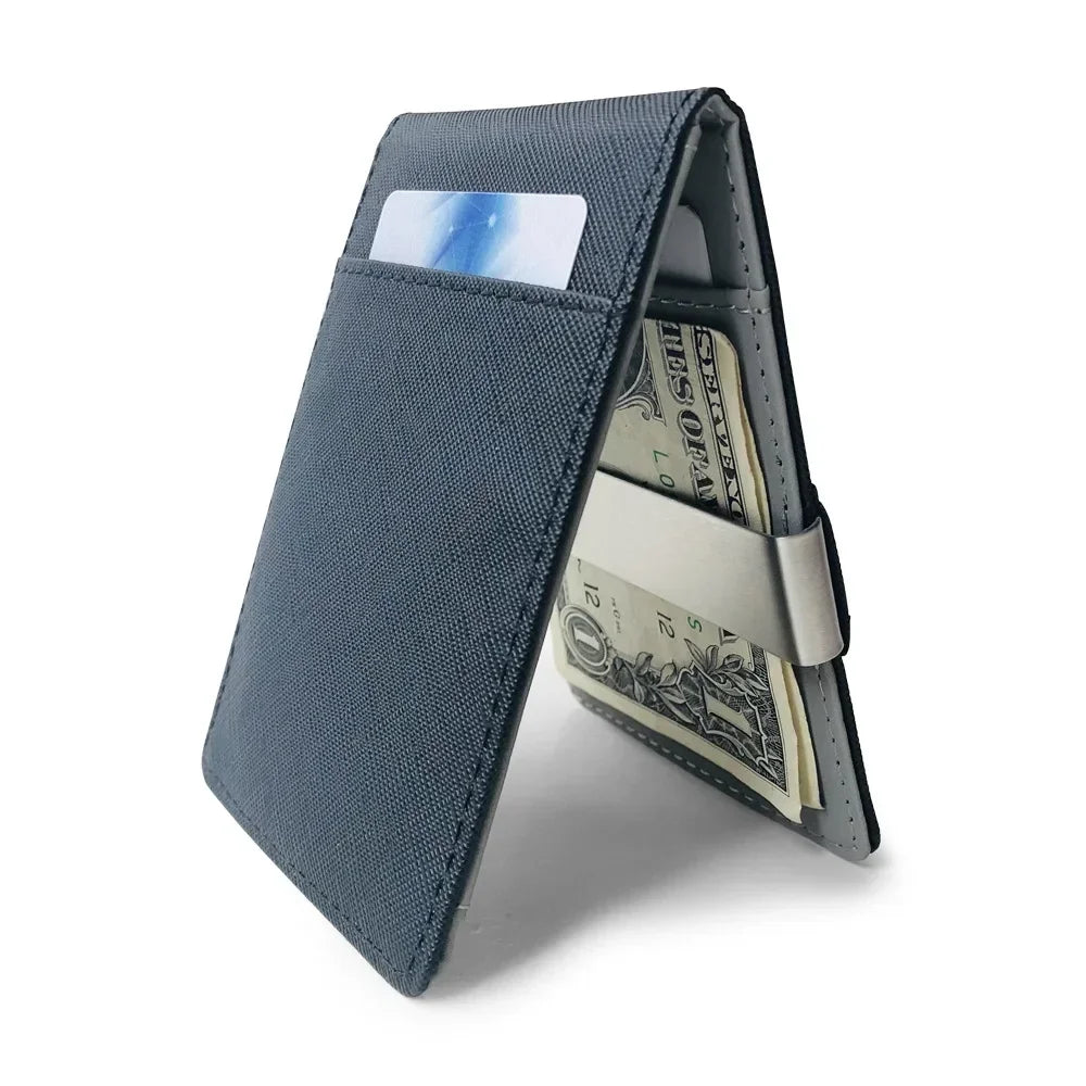 A dark blue slim leather bifold wallet with a money clip showing US currency inside.