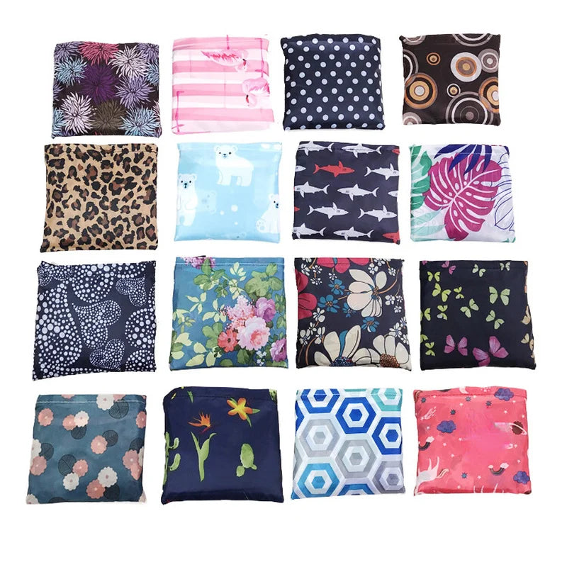 A collection of colorful fabric squares featuring various floral, animal, and geometric prints for storage or grocery use.