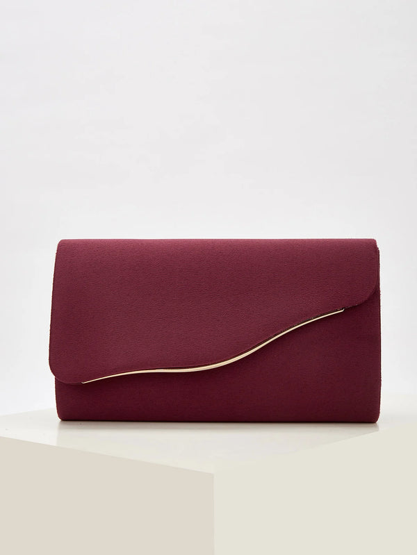 A deep burgundy velvet evening clutch with a smooth finish and a visible gold-colored edge.