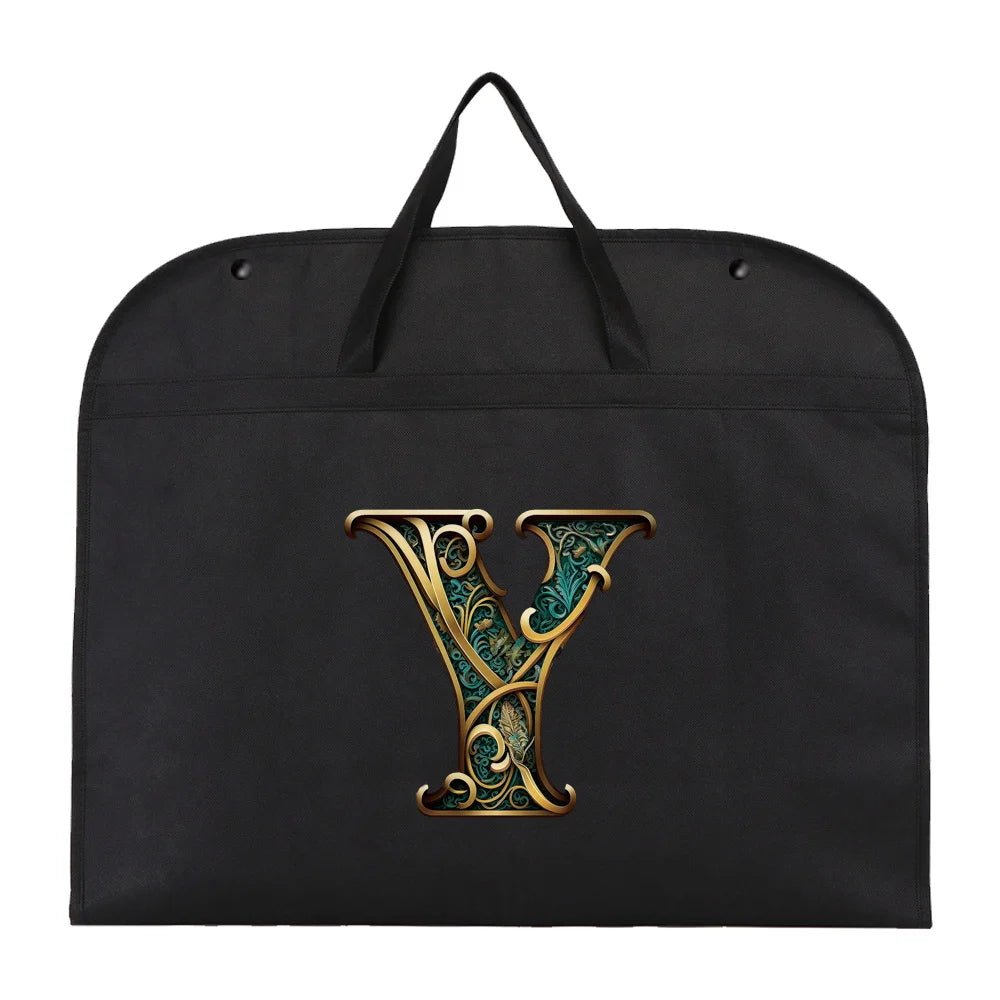 Black fabric dust cover and storage bag with a gold initial Y embroidered on it.