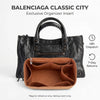 A black Balenciaga Classic City organizer insert featuring a brown felt pocket for organization.