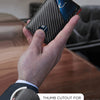 A hand holds a black woven wallet with a thumb cutout for quick access to a card.